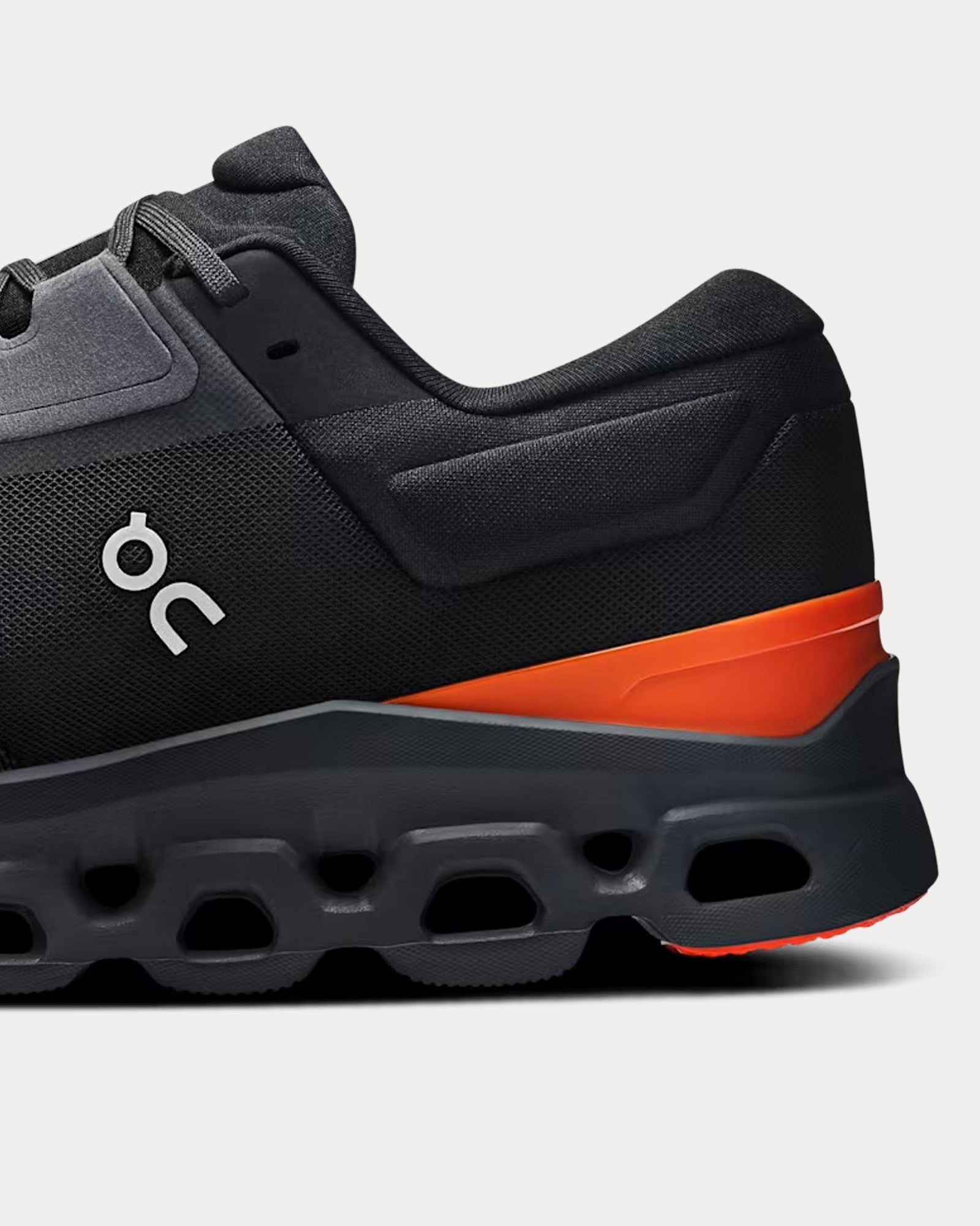 On Cloudstratus 3 running shoe in Eclipse black with orange Flame accent stripe