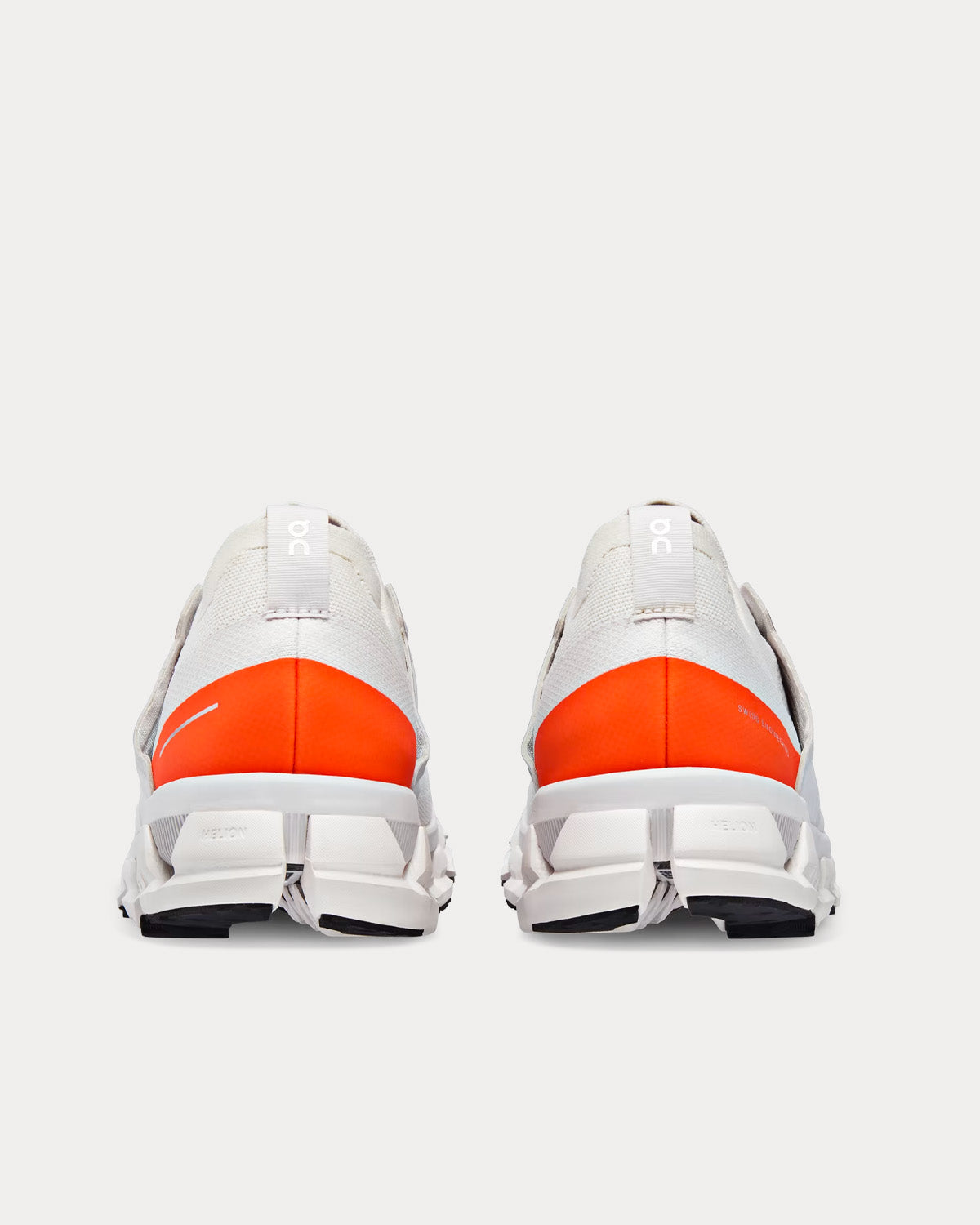 On Cloudswift 3 running shoes in ivory and flame orange colorway, rear view