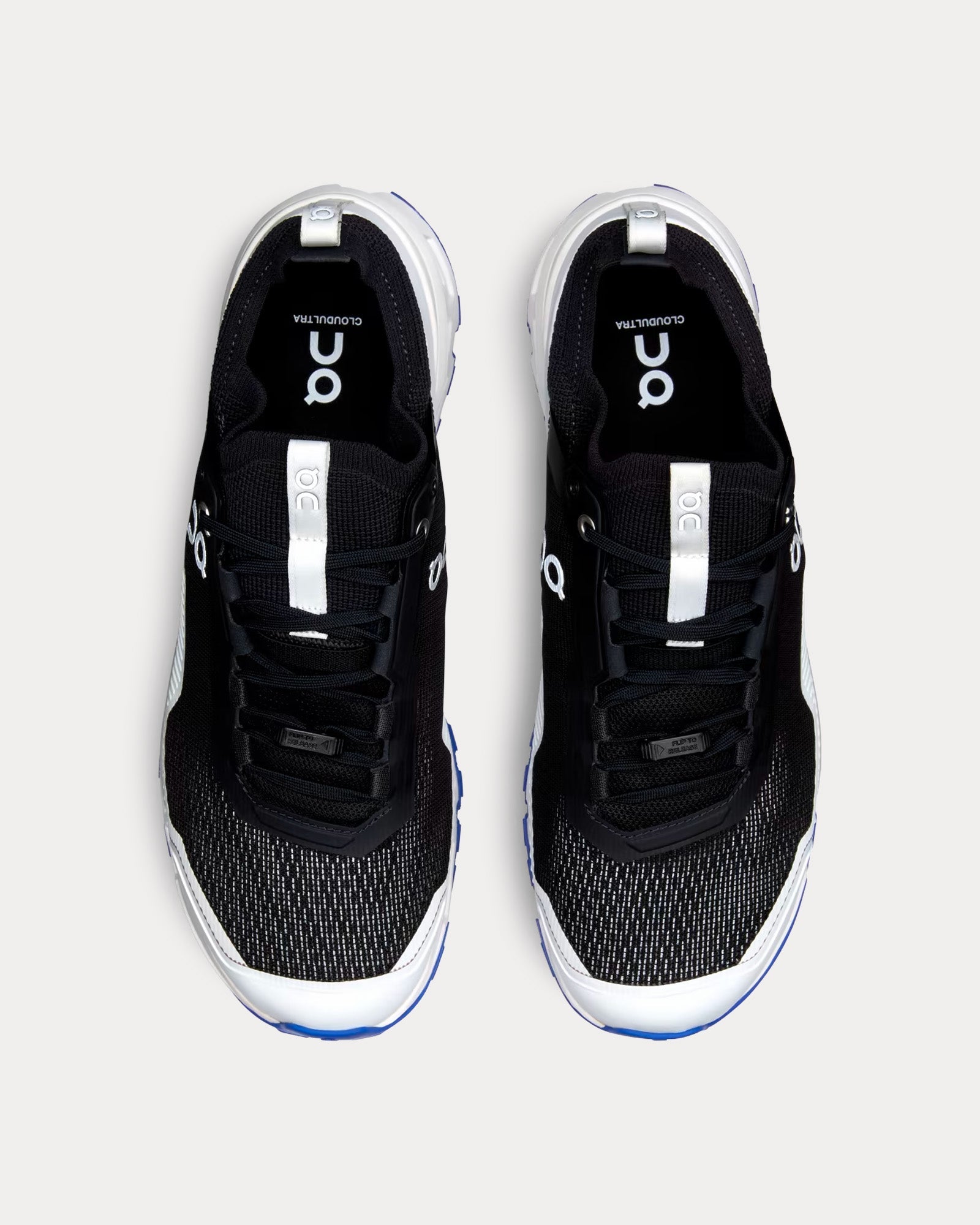On Cloudultra men's running shoes in black and white, top-down view pair