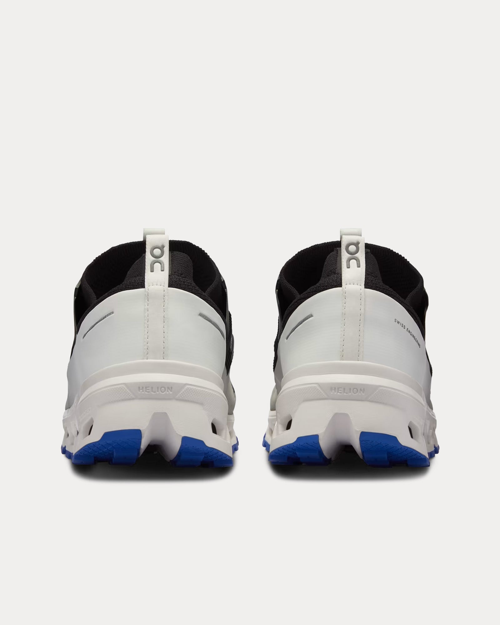 On Cloudultra men's running shoes in black and white, rear view showing Helion midsole