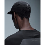 Back view of person wearing black On Performance Cap with adjustable strap