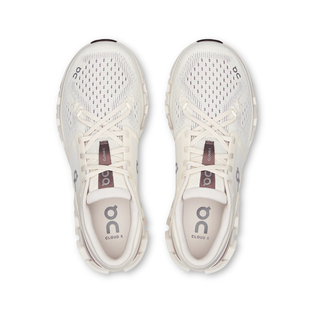On Cloud X 4 running shoes in ivory with purple dot pattern and white laces