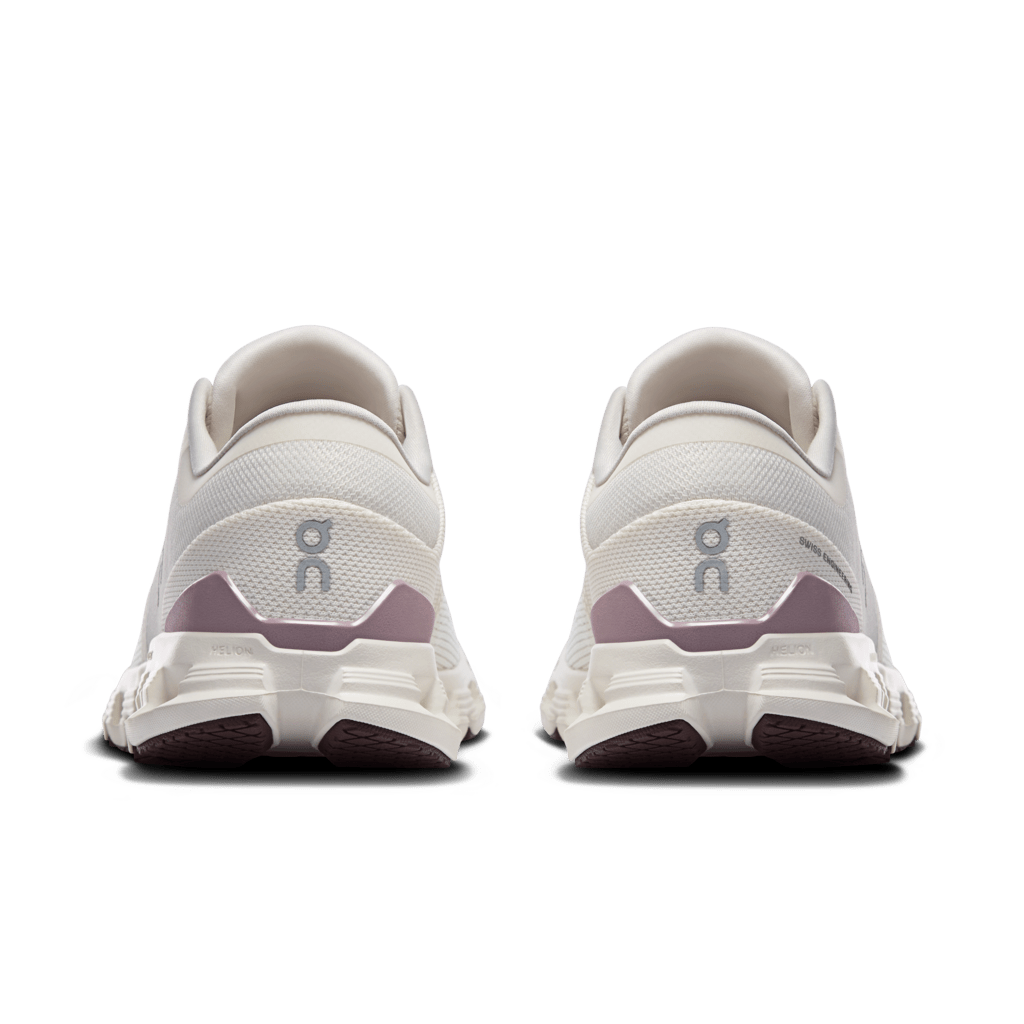 On Cloud X 4 women's running shoes in ivory and heron colorway, rear view