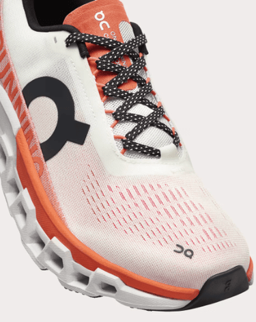 On Cloudmonster 2 running shoe in undyed white with orange zest accents