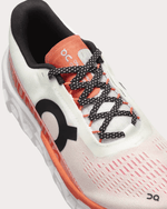 On Cloudmonster 2 running shoe in undyed white with orange zest accents