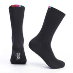 Black Velocio cycling socks with colorful striped cuff against white background