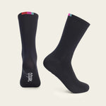 Velocio navy cycling socks with colorful striped cuff on clean background