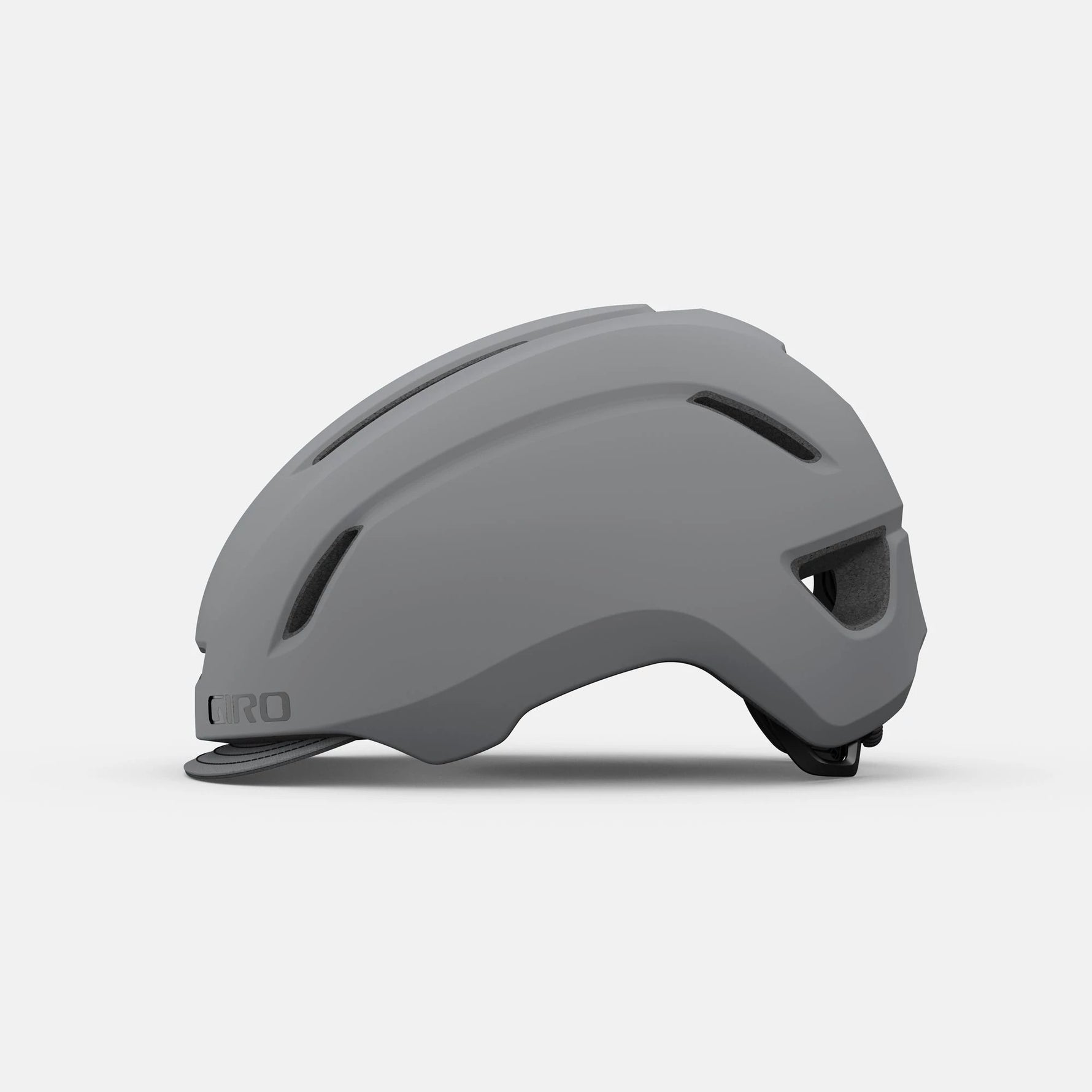 Giro Caden cycling helmet in matte grey, side profile view showing ventilation ports and streamlined design