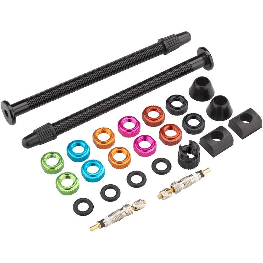 Orange Seal VersaValve Kit 80MM with tubeless valve stems, multicolor lock nuts, and accessories