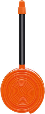 Orange Tubolito bicycle tube with Presta valve on white background