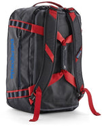 Patagonia Black Hole 40L duffel backpack in black with red straps, rear view