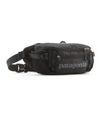 Patagonia Black Hole waist pack in black with adjustable strap and multiple compartments