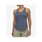 Woman wearing Patagonia heathered navy tank top with khaki shorts against white background