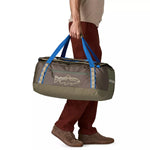 Man carrying Patagonia Black Hole Duffel 55L by blue handles in Basin Green colorway
