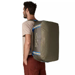 Man wearing Patagonia Black Hole Duffel 55L as backpack in Basin Green with Fitz Trout