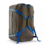 Patagonia Black Hole Duffel 55L backpack view showing blue harness straps in Basin Green