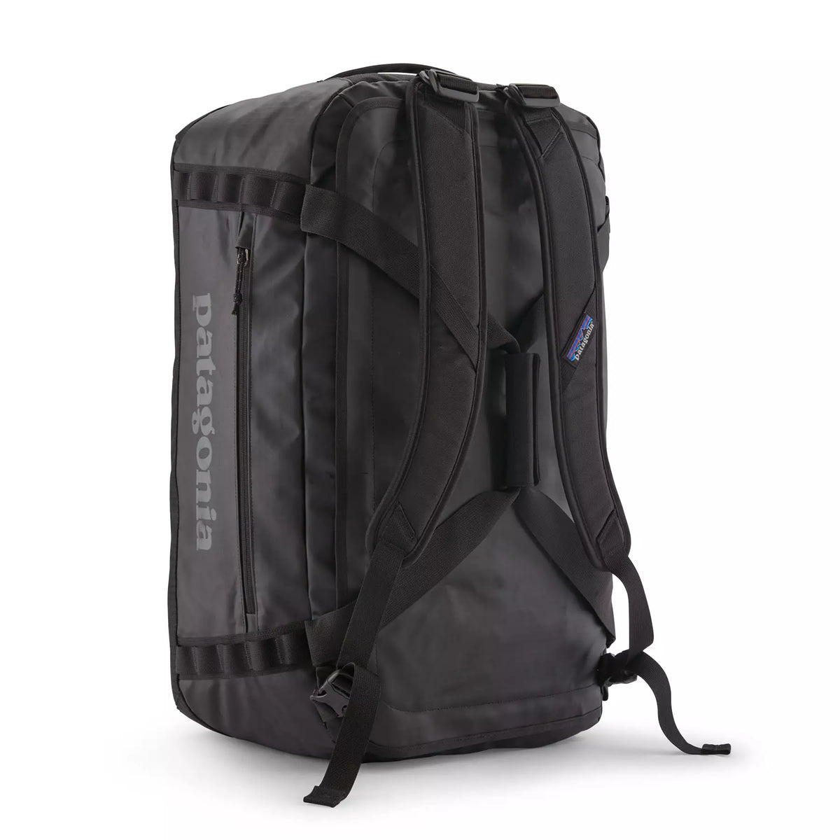 Patagonia Black Hole Duffel 55L showing backpack harness straps on rear panel in black