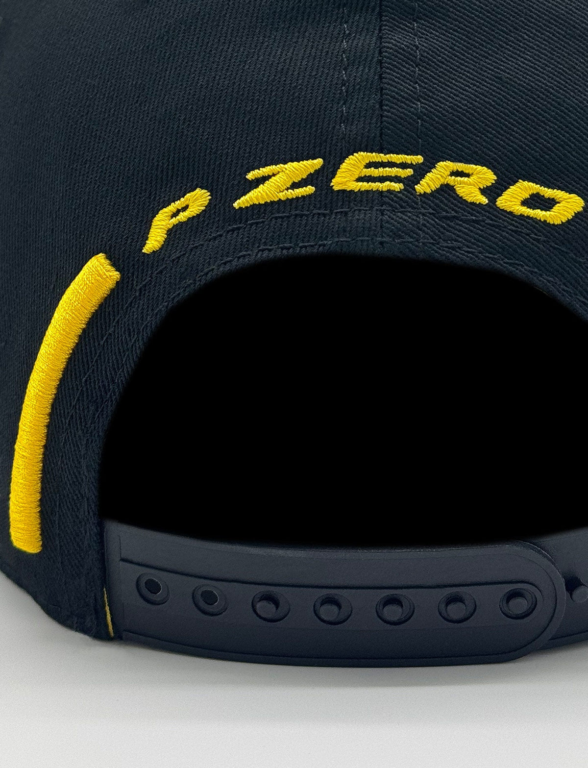 Pirelli P Zero navy blue snapback hat with yellow embroidered logo, rear view