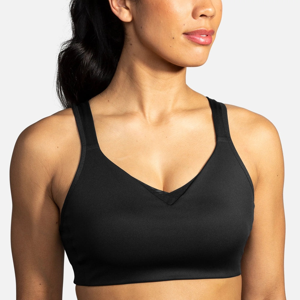 Brooks Drive Convertible Sports Bra in black worn by female model on grey background
