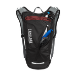 CamelBak Rogue hydration backpack in black with open compartment showing contents