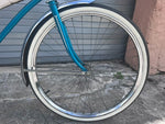 Handlebars with white grips and chrome detail on J.C. Higgins Flightliner