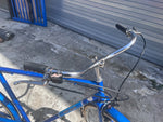 Swept-back chrome upright handlebars and shifter on the vintage Sears Free Spirit Sheffield