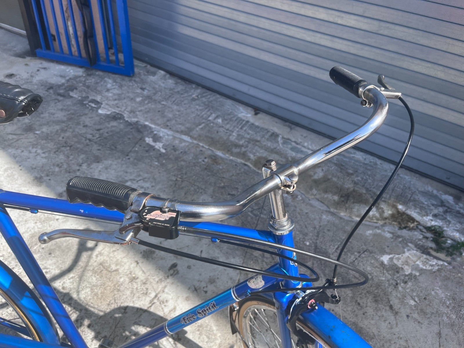 Swept-back chrome upright handlebars and shifter on the vintage Sears Free Spirit Sheffield