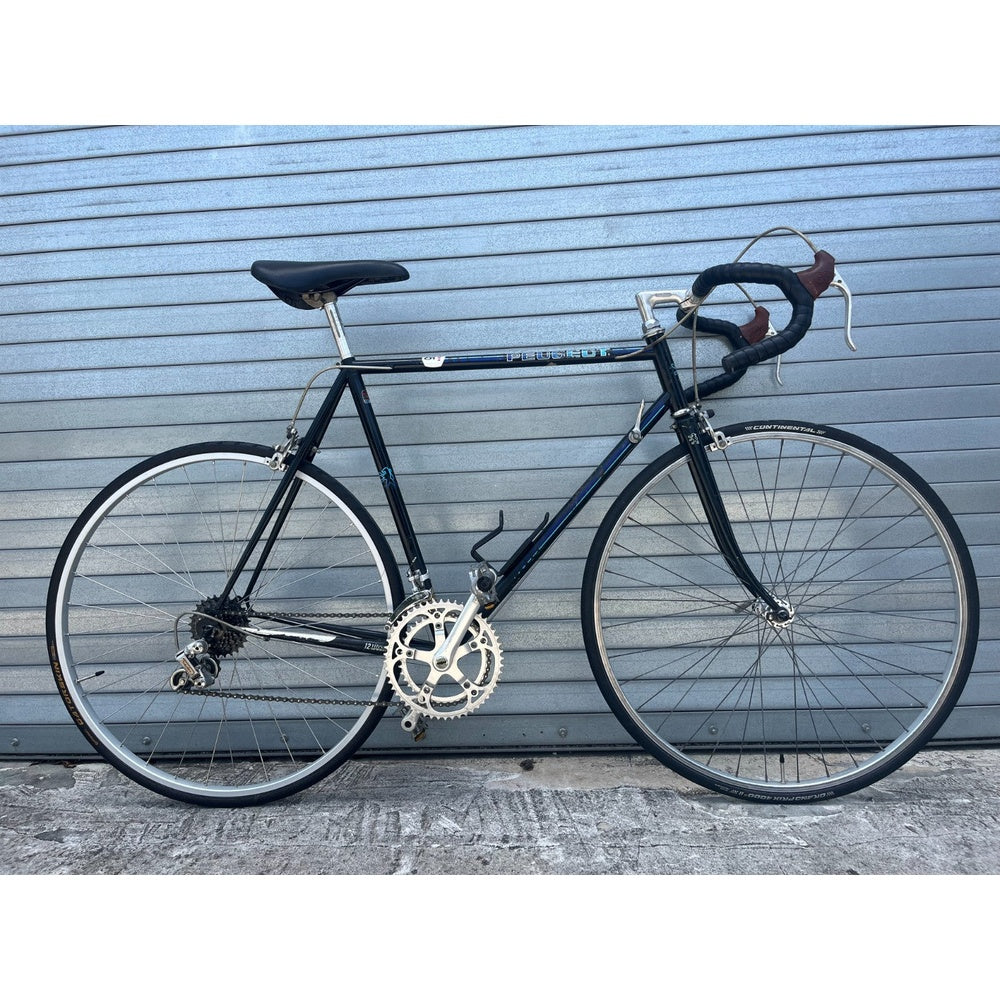 Vintage mid-1980s Peugeot 12-speed road bike, black lugged steel frame, made in France