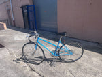 Schwinn Le Tour Mixte 10-speed side profile showing blue steel step-through frame