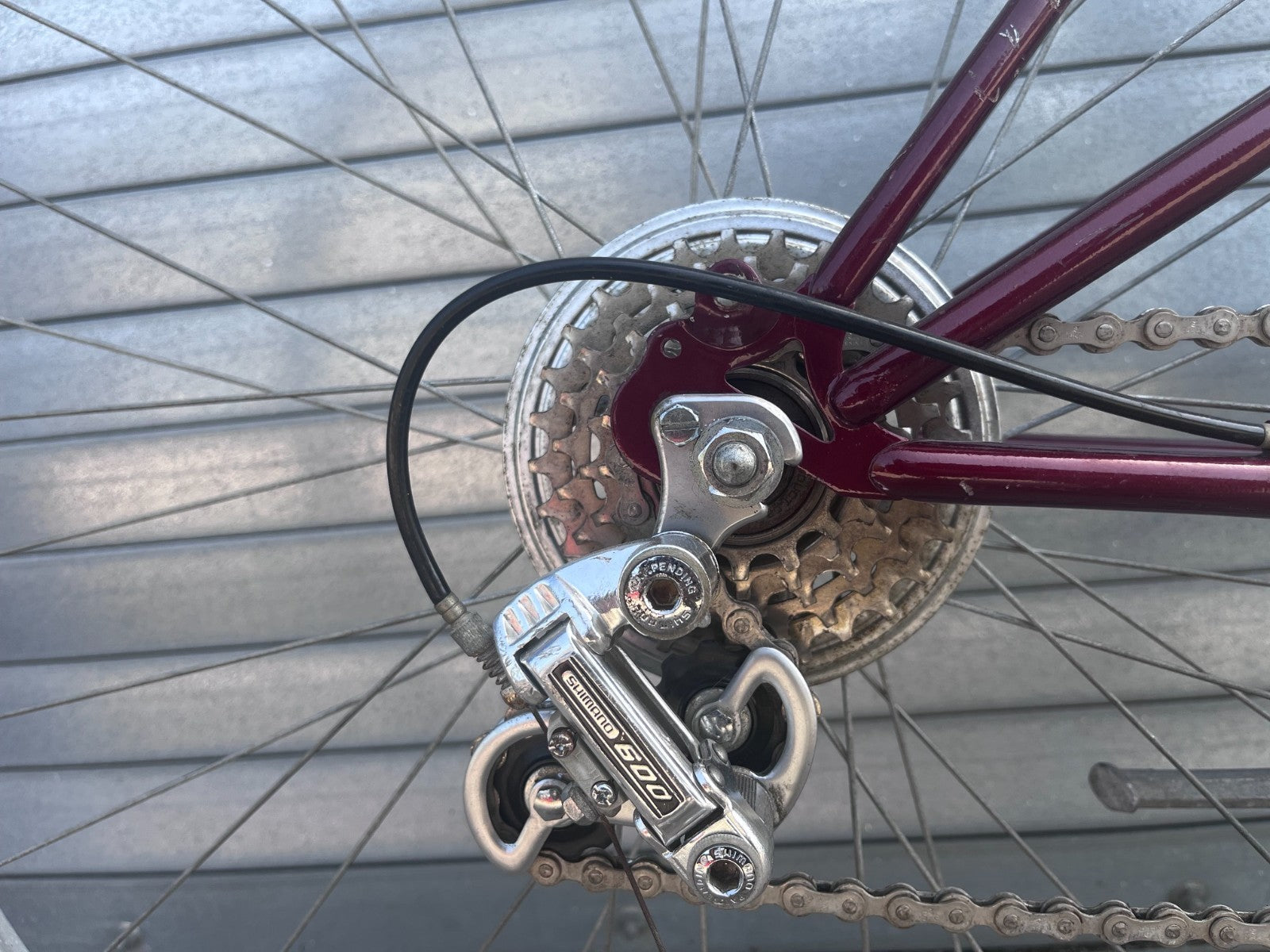 Close-up of SUTEKI vintage bike rear derailleur, cassette, and chain