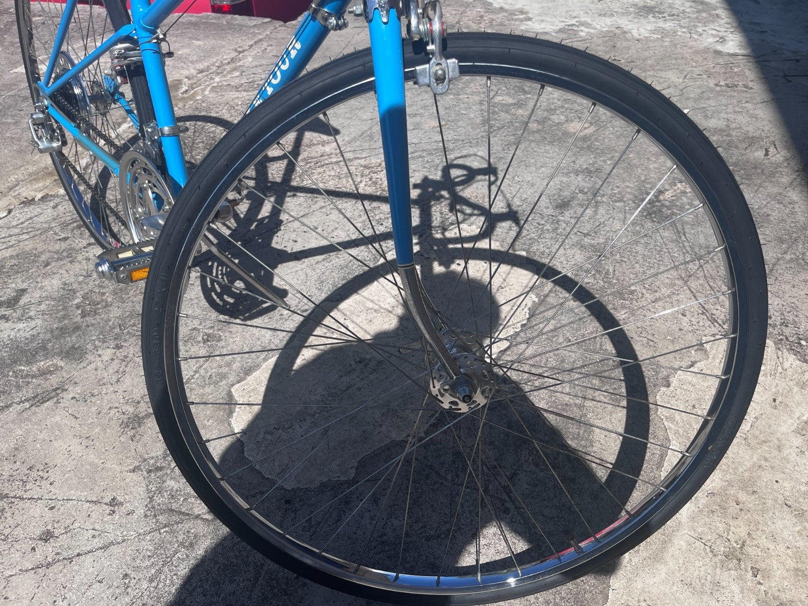 Front wheel and chrome fork of the vintage Schwinn Le Tour Mixte road bike