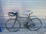 Kuota Factor TT bike side profile showing aero carbon frame and KUOTA down tube decal
