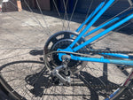 Rear derailleur, freewheel and chrome wheel detail on the Schwinn Le Tour Mixte