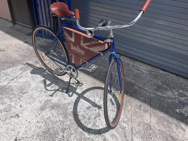 Centre kickstand, coaster brake wheel and cabinet interior on Three Olives bar bike