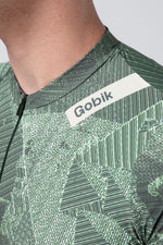 Gobik Attitude 2.0 short sleeve cycling jersey in Crash green geometric pattern with matching shorts