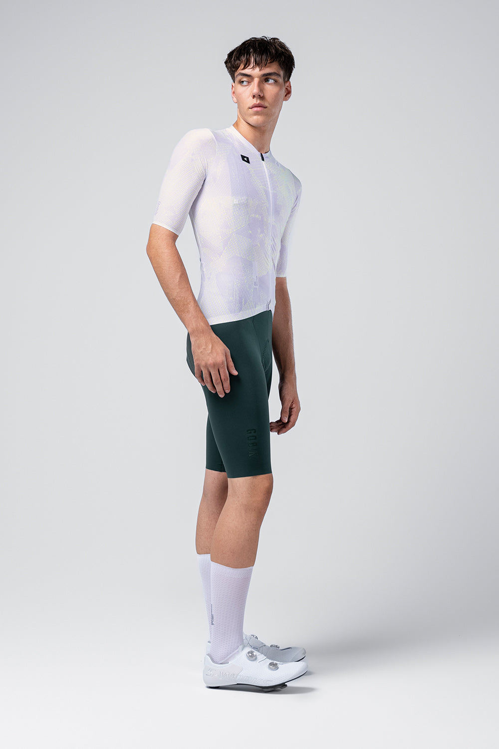 Gobik Attitude 2.0 short sleeve cycling jersey in Lag white colorway with green shorts