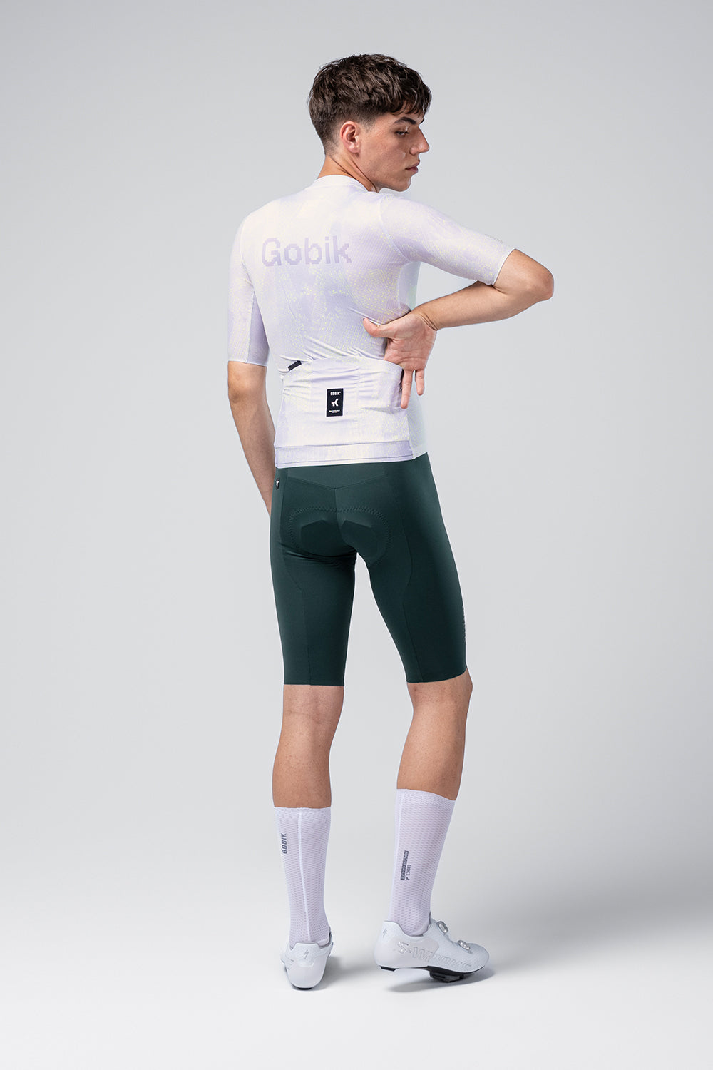 Gobik Attitude 2.0 Men's cycling jersey in white with green shorts, professional studio shot