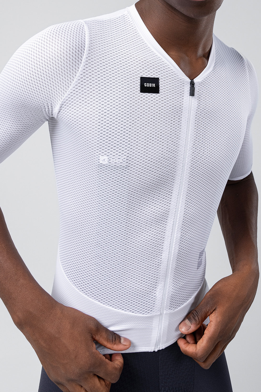White Gobik Carrera mesh cycling jersey with full zip on male model