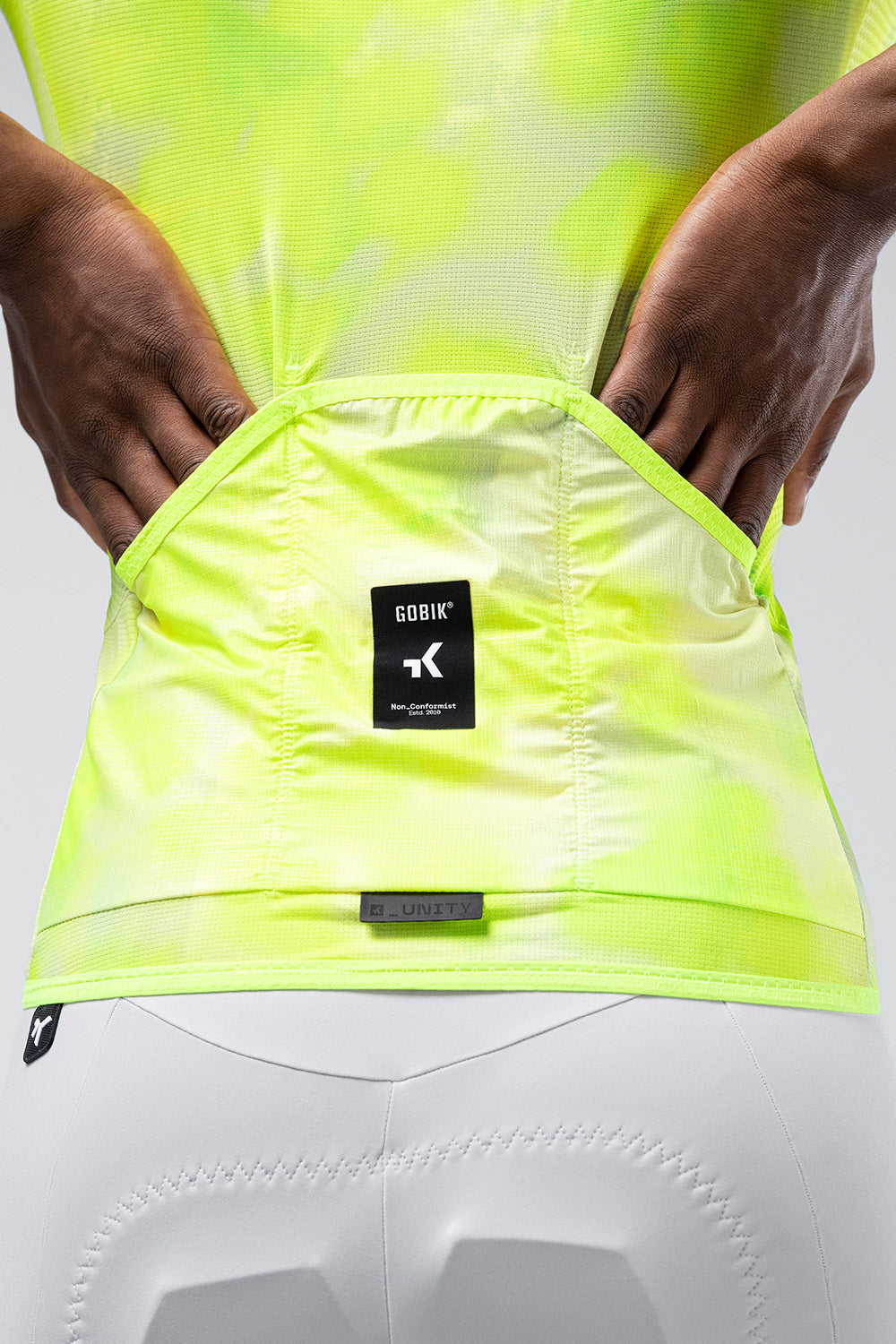 GOBIK Carrera 3.0 cycling jersey in nuclear yellow-green color, back view showing logo