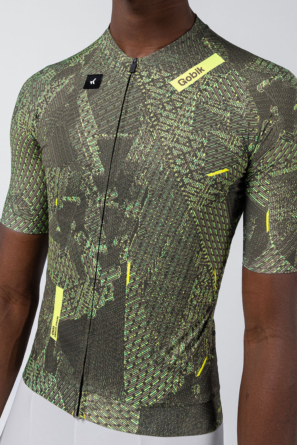 Gobik CX Pro cycling jersey with green grid pattern and yellow accents