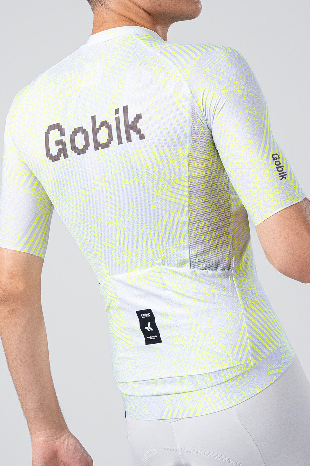 Gobik CX Pro cycling jersey in white with neon yellow pattern, rear view