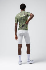 Gobik CX Pro 4.0 cycling jersey in green grid pattern, rear view on model