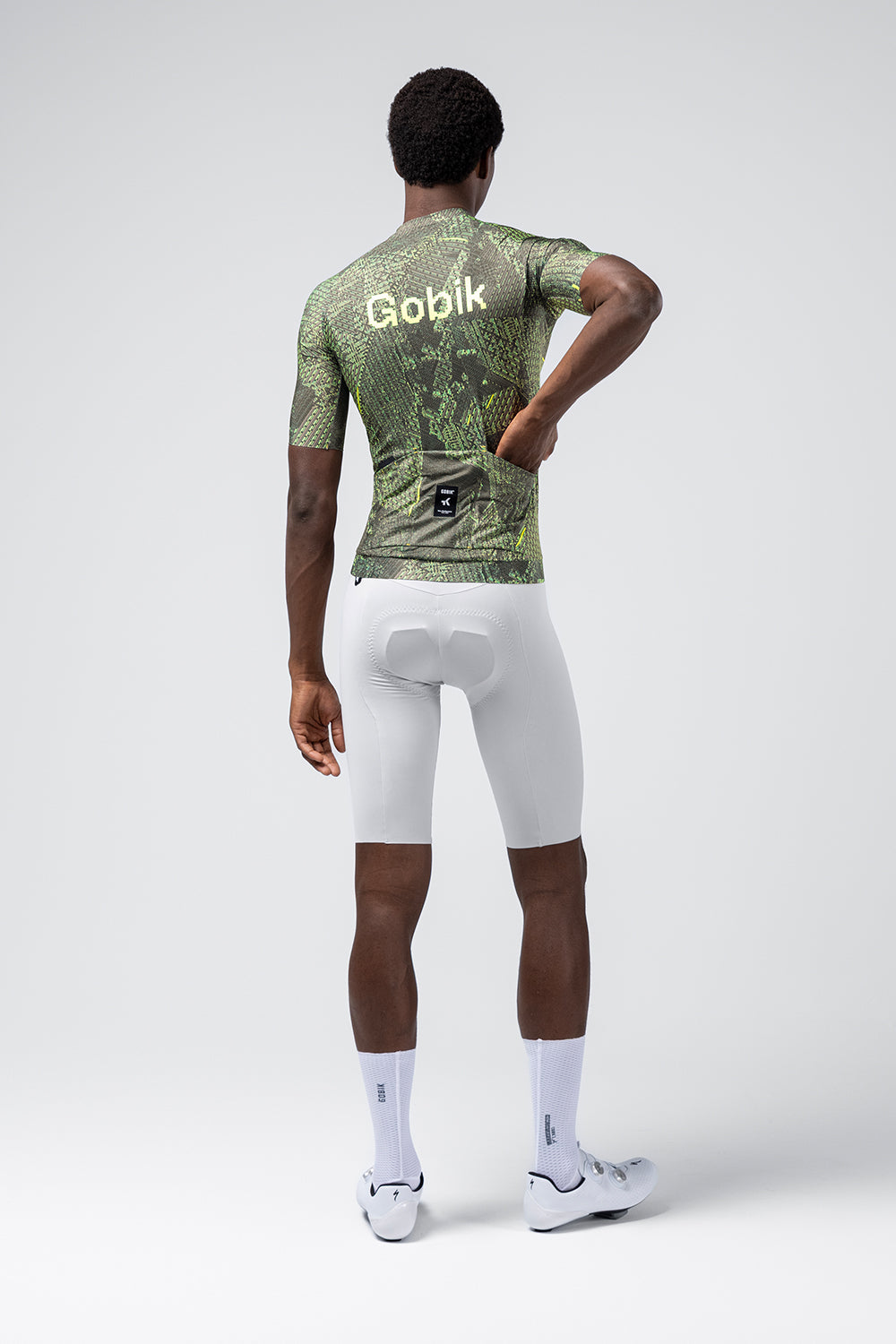 Gobik CX Pro 4.0 cycling jersey in green grid pattern, rear view on model