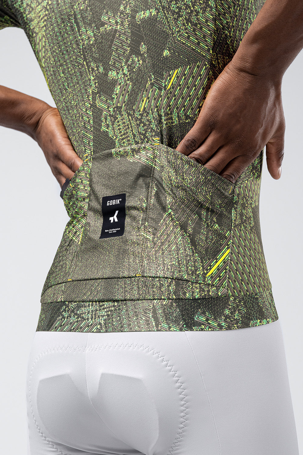Gobik CX Pro jersey with green digital circuit pattern worn by cyclist