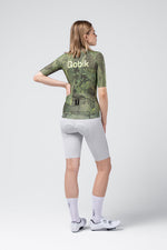 Gobik CX Pro 4.0 short sleeve cycling jersey in green grid pattern worn by female model
