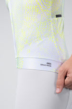 Gobik CX Pro 4.0 cycling jersey hem detail showing Glitch Mode 001 label in neon yellow pattern