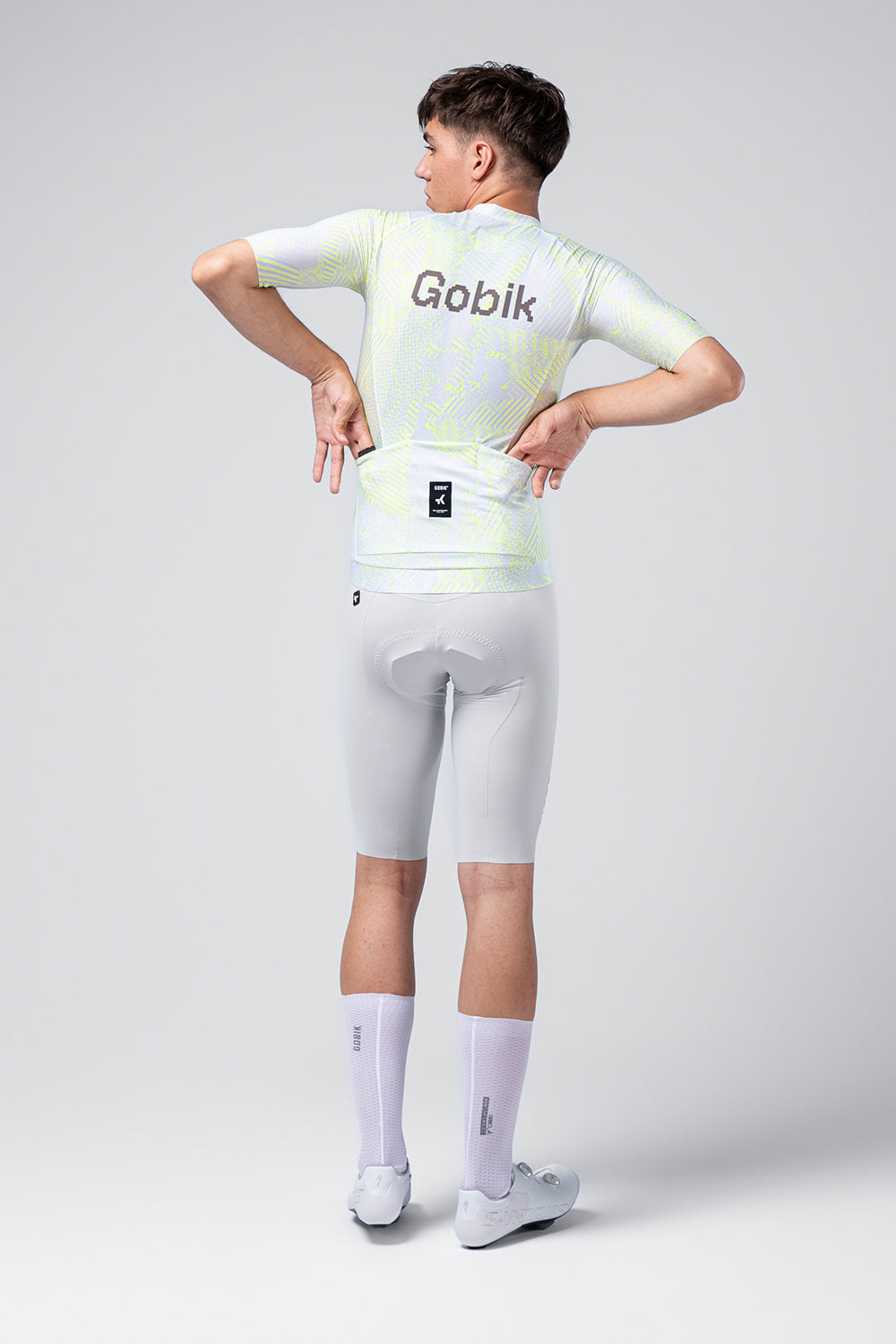 Gobik CX Pro Jersey in white with neon green Amazonian pattern, shown from back
