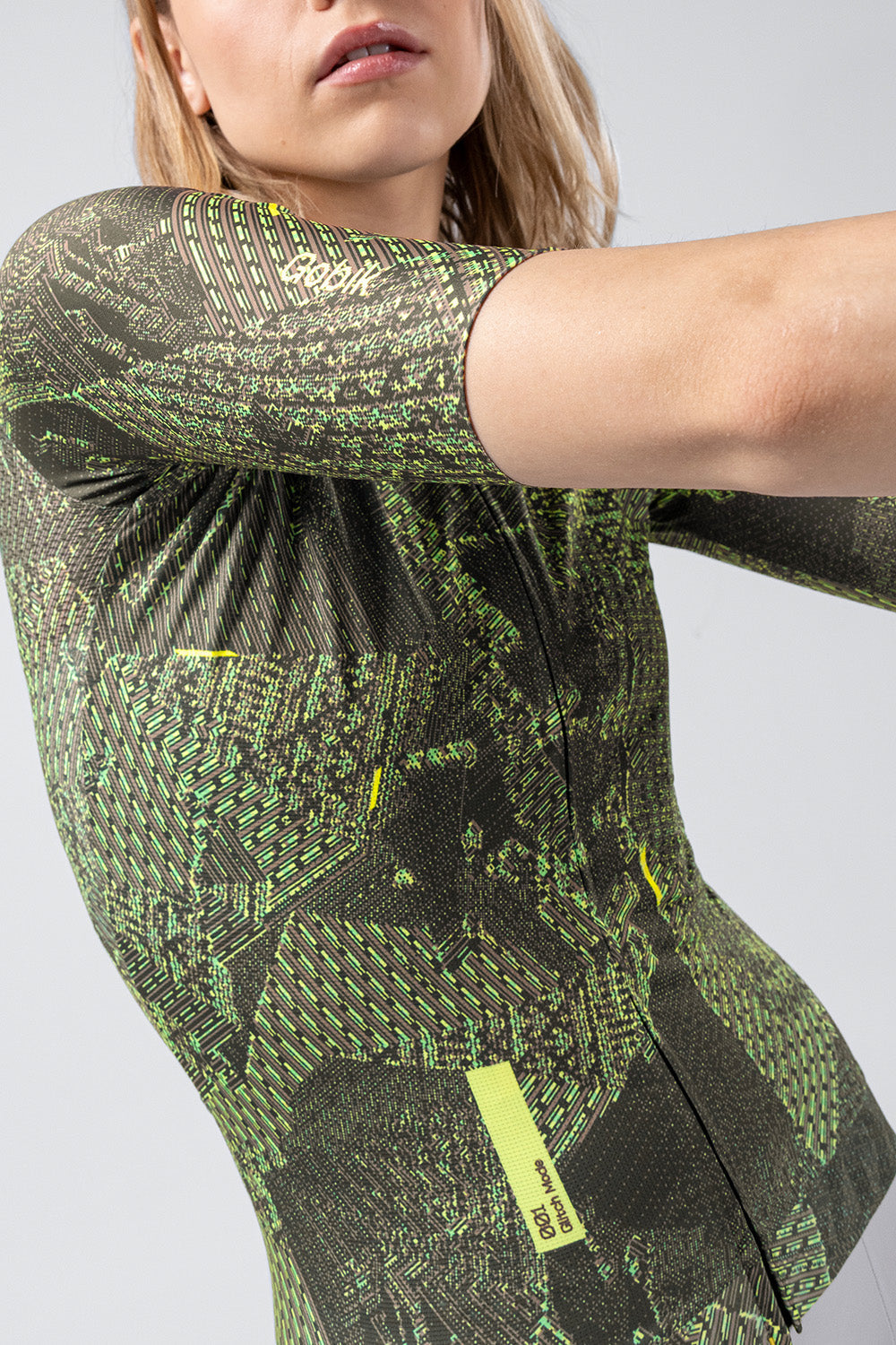 Gobik CX Pro 4.0 cycling jersey in green grid pattern worn by model