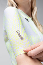 Gobik CX Pro cycling jersey in white with neon green digital pattern worn by model