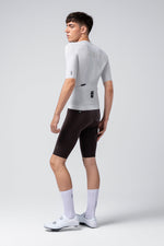 Male model wearing Gobik CX Solid short sleeve cycling jersey in Empire gray with black shorts